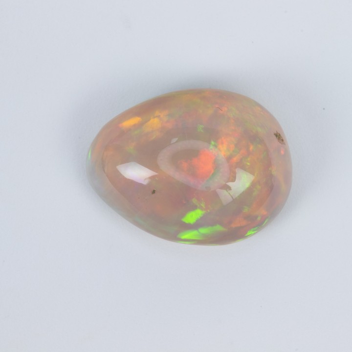 7.08ct Natural Rainbow White Ethiopian Opal Cabochon Oval-cut Single Gemstone, 16.35x12.5mm.  Auction Guide: £350-£450