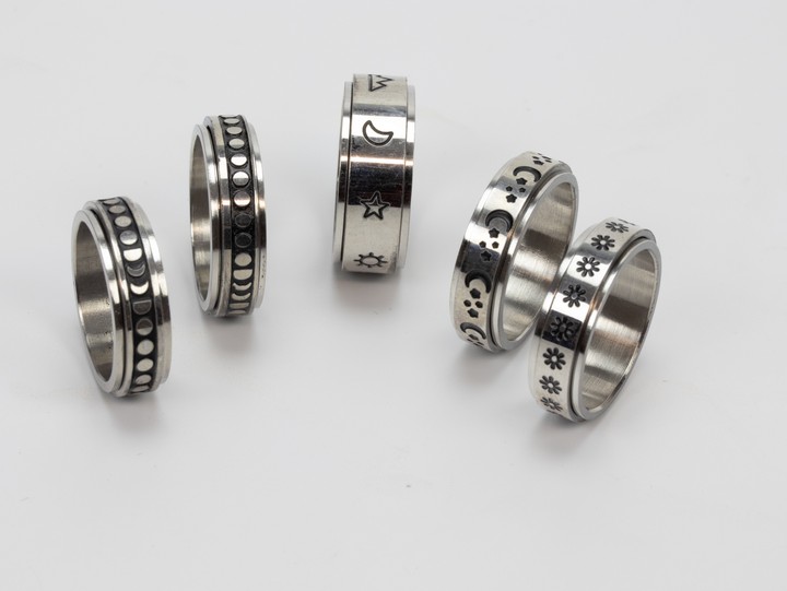 Selection of Four Metal Patterned Band Rings, Size N½ and One Metal Patterned Band Ring, Size L½, total weight 24.2g (VAT Only Payable on Buyers Premium)