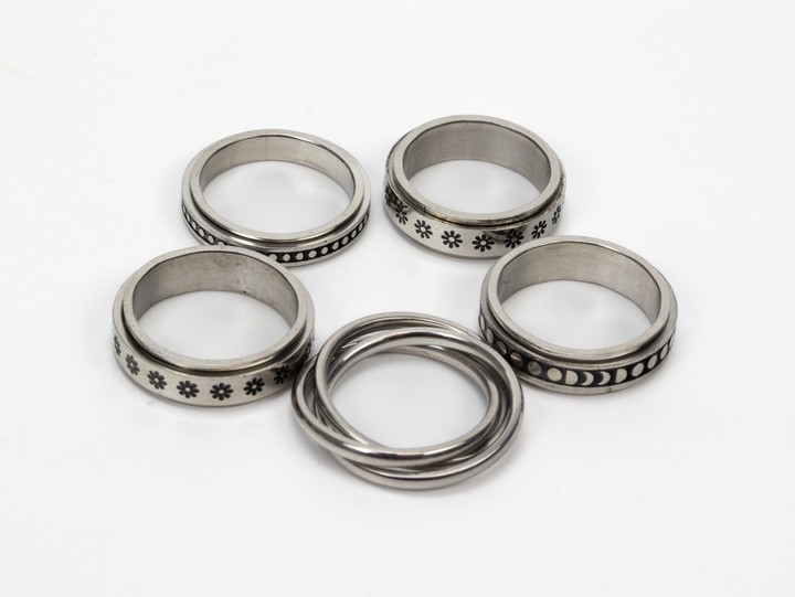 Selection of Four Metal Patterned Band Rings, Size N½ and One Metal Patterned Band Ring, Size L½, total weight 20g (VAT Only Payable on Buyers Premium)