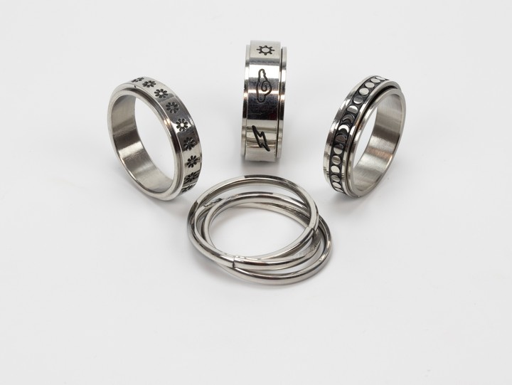 Selection of Four Metal Patterned Band Rings, Size S, total weight 20.8g (VAT Only Payable on Buyers Premium)