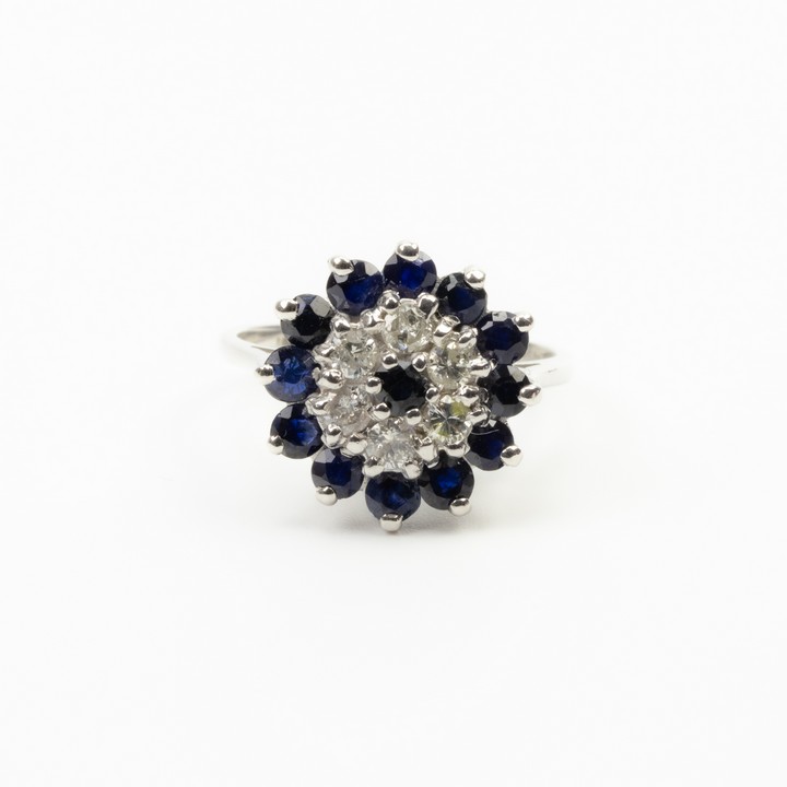 18K White 1.20ct Sapphire and 0.36ct Diamond Cluster Ring, Size L, 4.9g. Colour F-G, Clarity VS-Si.  Auction Guide: £600-£800 (VAT Only Payable on Buyers Premium)