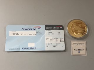 A 22 CARAT GOLD PLATED OVERSIZED COMMEMORATIVE CROWN, THE FINAL FLIGHT OF CONCORDE, WITH REPLICA TICKET AND CERTIFICATE OF AUTHENTICITY