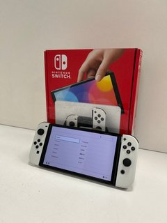 NINTENDO SWITCH OLED MODEL 64 GB GAMES CONSOLE IN WHITE: MODEL NO HEG-001 (WITH BOX & ALL ACCESSORIES) [JPTM113726] THIS PRODUCT IS FULLY FUNCTIONAL AND IS PART OF OUR PREMIUM TECH AND ELECTRONICS RA