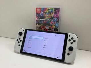 NINTENDO SWITCH OLED MODEL 64GB GAMES CONSOLE IN WHITE: MODEL NO HEG-001 (WITH ACCESSORIES AS PHOTOGRAPHED, TO INCLUDE MARIO KART 8 DELUXE GAME) [JPTM113776] THIS PRODUCT IS FULLY FUNCTIONAL AND IS P