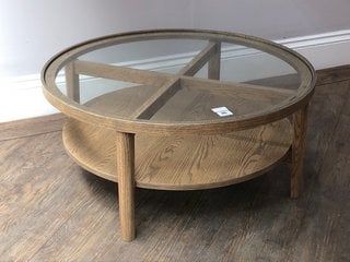 HOLCOT LARGE ROUND COFFEE TABLE IN GREY WASHED ASH FINISH WITH CLEAR GLASS TOP - RRP £529: LOCATION - C3