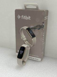 FITBIT LUXE FITNESS TRACKER IN LUNAR WHITE / SOFT GOLD: MODEL NO FB422 (WITH BOX & ALL ACCESSORIES, MINOR COSMETIC IMPERFECTIONS) [JPTM114224]. THIS PRODUCT IS FULLY FUNCTIONAL AND IS PART OF OUR PRE