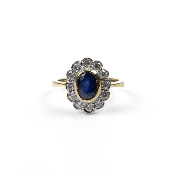 9ct Yellow and White Gold 1.50ct Sapphire and 0.50ct Diamond Halo Ring, Size O, 4.5g.  Auction Guide: £400-£500 (VAT Only Payable on Buyers Premium)