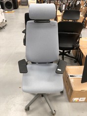 STEELCASE GREY WORK CHAIR WITH RECLINING ARMS, HAS A TEAR IN THE UPPER RIGHT HAND SIDE.