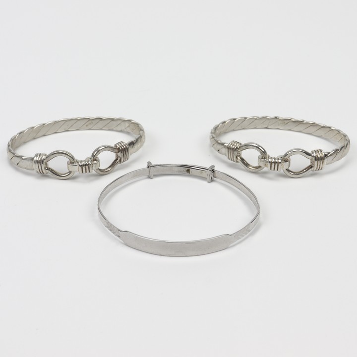 Silver Adjustable Patterned Baby Bangle and Two Silver Baby Twist Double Clip Bangles, 12cm, total weight 25.8g (VAT Only Payable on Buyers Premium)