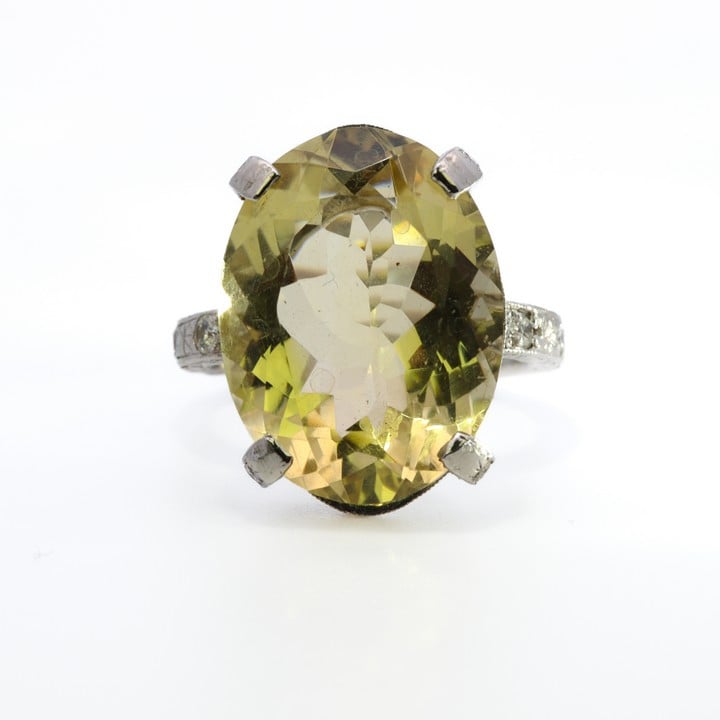 Platinum 950 Yellow Stone with Diamond Pavé Surround and Shoulders Ring, Size N, 10.8g.  Auction Guide: £300-£400 (VAT Only Payable on Buyers Premium)