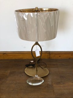 BRUSHED BRASS ORNAMENTAL TABLE LAMP WITH NATURAL/GOLD COLOURED SHADE WITH GLASS CENTREPIECE RRP £495: LOCATION - B7