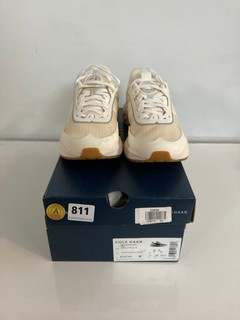 A PAIR OF COLE HAAN ZERO GRAND TRAINERS IN IVORY SIZE 5