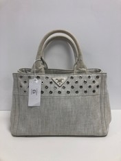 PRADA, SMALL STUDDED CANAPA TOTE IVORY STUDDED DENIM CANVAS SHOULDER BAG WITH IVORY CANVAS. ITEM TO INCLUDE CARD, STRAP, DUSTBAG WITH AN ESTIMATED SIZE OF 28*18*15CM (ITEM INCLUDES A CERTIFICATE OF A