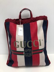GUCCI, STRIPED DRAWSTRING BACKPACK BLUE/RED/WHITE LOGO PRINT CANVAS BACKPACK WITH RED LEATHER/CANVAS. ITEM TO INCLUDE DUSTBAG WITH AN ESTIMATED SIZE OF 36*43*1CM (ITEM INCLUDES A CERTIFICATE OF AUTHE