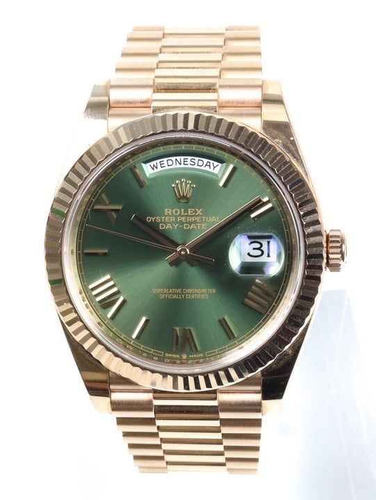 Rolex Day-Date 40 Ref: 228235 Automatic Watch. 40mm 18ct Rose Gold Case with 18ct Rose Gold Fluted Bezel, Olive Dial and 18ct Rose Gold President Bracelet. Age: 2019. Comes with box, guarantee card a