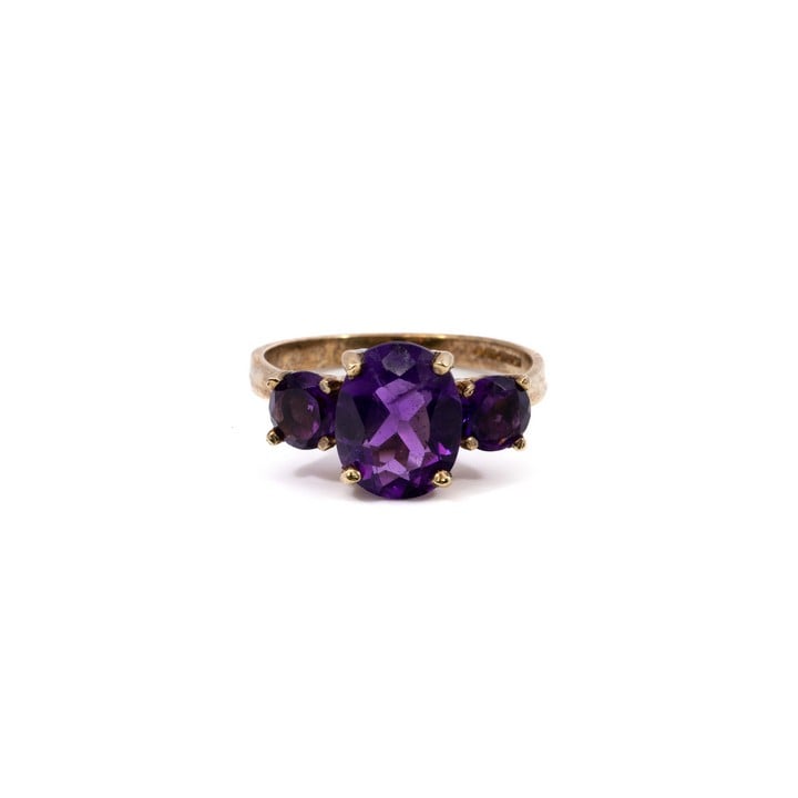 9ct Yellow Gold Amethyst Three Stone Ring, Size N½, 3.4g.  Auction Guide: £150-£200