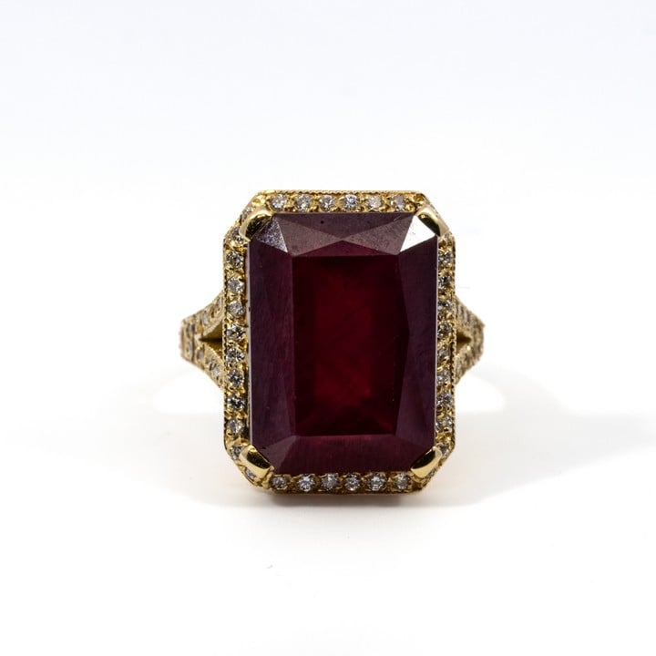 18ct Yellow Gold 15.00ct Enhanced Afghan Ruby with 0.60ct Diamond Halo and Shoulders Ring, Size N, 12.6g.  Auction Guide: £450-£550 (VAT Only Payable on Buyers Premium)