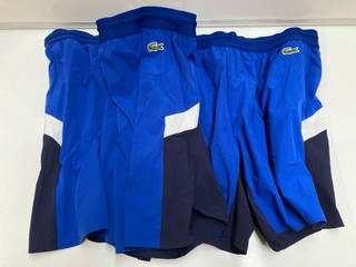 2 X MENS CLOTHING ITEMS TO INCLUDE LACOSTE SWIM SHORTS IN SIZE XL