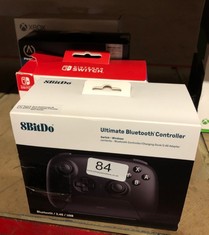 QTY OF ITEMS TO INCLUDE 8BITDO ULTIMATE BLUETOOTH & 2.4G CONTROLLER WITH CHARGING DOCK FOR SWITCH AND WINDOWS - BLACK: LOCATION - A RACK