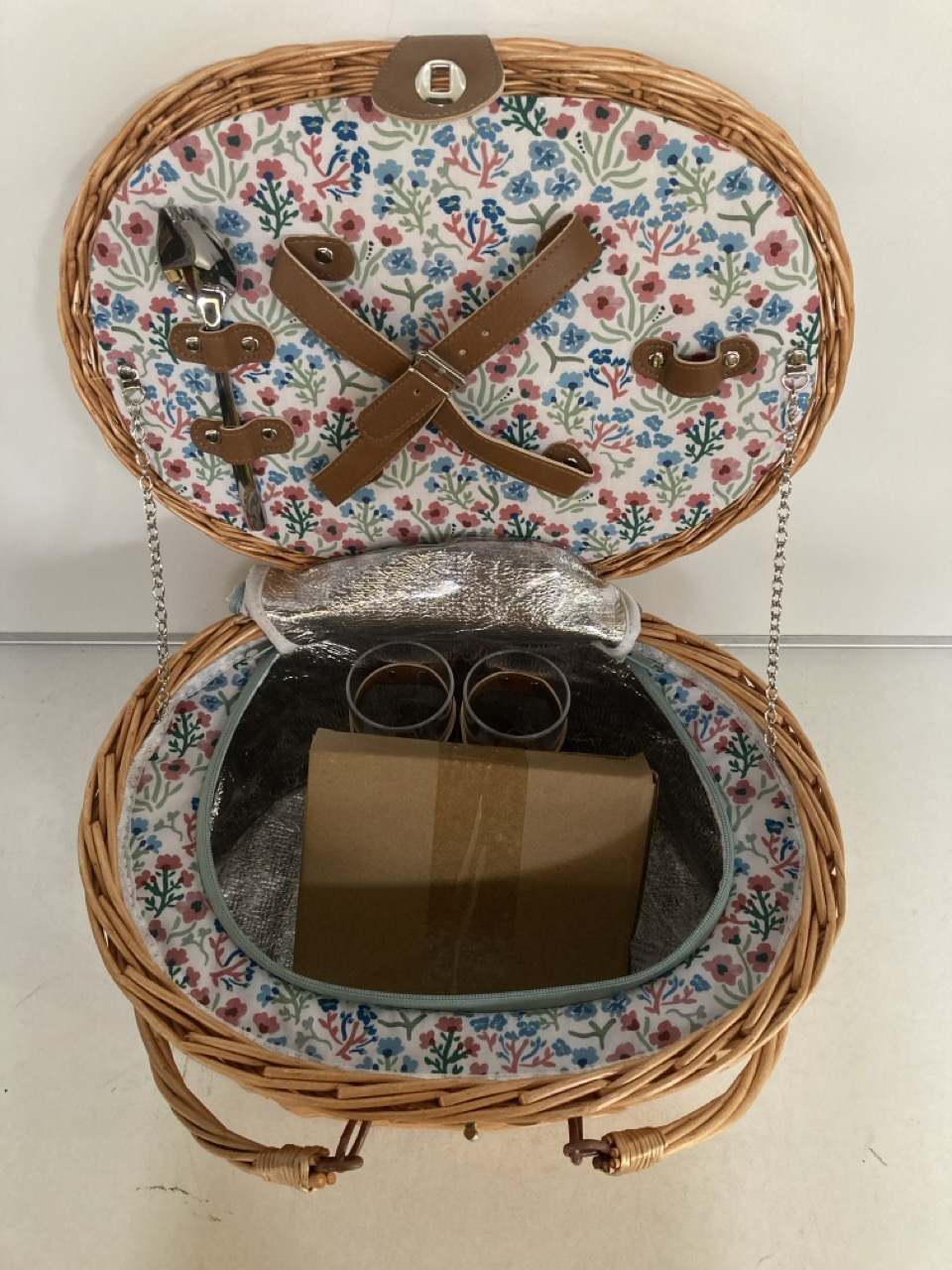 A WICKER PICNIC BASKET TOGETHER WITH PICNIC RUGS , PLATES & BOWLS