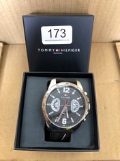 MENS TOMMY HILFIGER WATCH WITH BLACK FACE AND RUBBER STRAP: LOCATION - A RACK