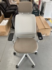BLACK, WHITE AND BEIGE OFFICE CHAIR.