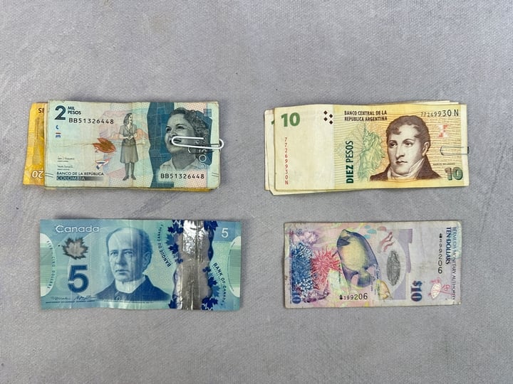Selection Of Currency, Including Approx 39 Brazilian Reais, 64 Argentinian Peso, 19 Columbian Dollar, Canadian Dollar, Bermudan Dollar (VAT ONLY PAYABLE ON BUYERS PREMIUM)