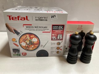 A TEFAL INGENIO SAUCEPAN SET TOGETHER WITH A PEUGEOT SALT AND PEPPER MILL SET