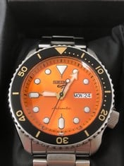 SEIKO AUTOMATIC WATCH WITH DAY AND DATE STAINLESS STEEL WITH ORANGE AND BLACK STYLE FACE: LOCATION - A