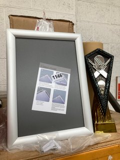 BOX OF 10 SILVER A4 SNAP FRAME TO INCLUDE KARTE INSULATED WATER BOTTLE IN BLUE AND CRICKET TROPHY: LOCATION - H11