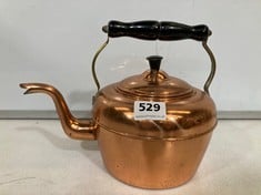 AN ANTIQUE COPPER KETTLE