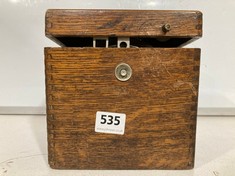 AN ANTIQUE BELGICA PIGEON CLOCK IN AN OAK CASE