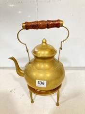 AN INDIAN BRASS SPIRIT KETTLE AND STAND