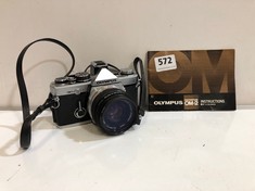 AN OLYMPUS OM-2 35MM FILM CAMERA AND INSTRUCTION BOOK