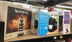 QUANTITY OF ITEMS TO INCLUDE NESPRESSO CITIZ AUTOMATIC POD COFFEE MACHINE FOR AMERICANO, DECAF, ESPRESSO BY KRUPS IN SILVER: LOCATION - D