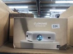 QUANTITY OF ITEMS TO INCLUDE CLOKOWE LED PROJECTOR TO PROJECT IMAGES AND VIDEOS ON WALLS COLOUR WHITE + SMALL SMART PROJECTOR FOR HOME USE WITH REMOTE CONTROL FUNCTIONALITY: LOCATION - D