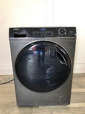 HAIER BLACK WASHING MACHINE MODEL HWD100-B14959S8UI: LOCATION - FRONT FLOOR(COLLECTION OR OPTIONAL DELIVERY AVAILABLE)