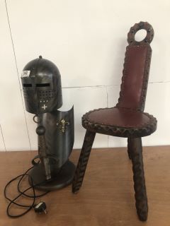 REPLICA METAL CRUSADER KNIGHT HELMET AND SHIELD AND SWORD LAMP SHADE TO INCLUDE A 3 LEGGED BROWN WOODEN RED COLOURED CHAIR