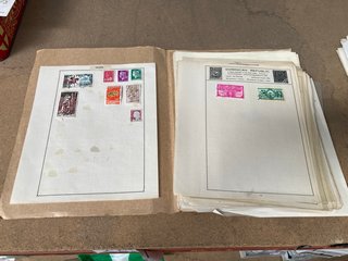 A LOOSE LEAF FOLDER OF SHEETS OF ANTIQUE AND VINTAGE INTERNATIONAL STAMPS: LOCATION - AR16