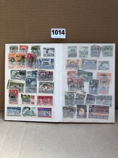 A STOCK BOOK OF ASSORTED VINTAGE STAMPS: LOCATION - AR8