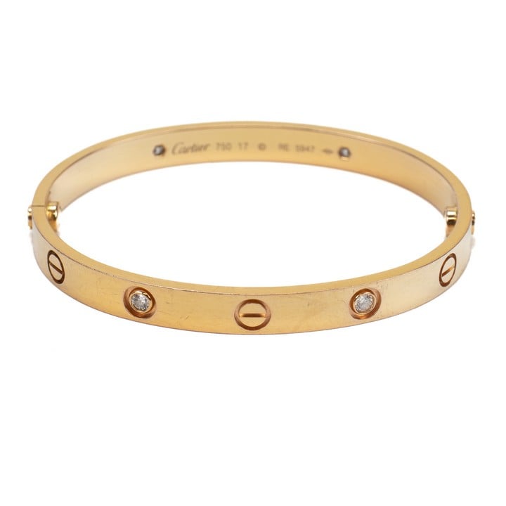 Cartier 18K Yellow 0.28ct Diamond Four Stone Love Bangle, 16cm, 29.7g.  Auction Guide: £1,500-£2,000 (VAT Only Payable on Buyers Premium)