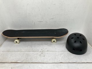 SKATEBOARD WITH BLACK AND WHITE CHECKERED DESIGN TO INCLUDE ALL BLACK HELMET: LOCATION - C4