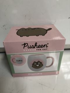 A BOX OF "PUSHEEN THE CAT" SHAPED COFFEE MUGS