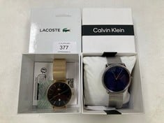 2 X LACOSTE WATCH MODEL 10.174.774 GOLD COLOUR AND CALVIN KLEIN WATCH MODEL 5076.9276 SILVER COLOUR - LOCATION 6B.