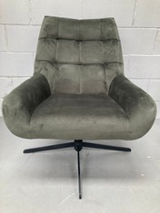 ELEGANT FABRIC ARMCHAIR WITH BLACK METAL BASE IN THE SHAPE OF A DARK GREEN STAR.