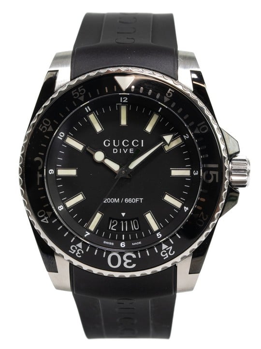 Gucci Dive Quartz Watch
Ref: 136.2
Year: Unknown
Size: 45mm
Case: Stainless Steel Case with Black Stainless Steel Uni-Directional Bezel, Black Dial with Date Indicator
Strap: Black Rubber Gucci Strap