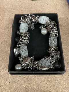 A CHARM BRACELET WITH POLISHED STONES: LOCATION - CR