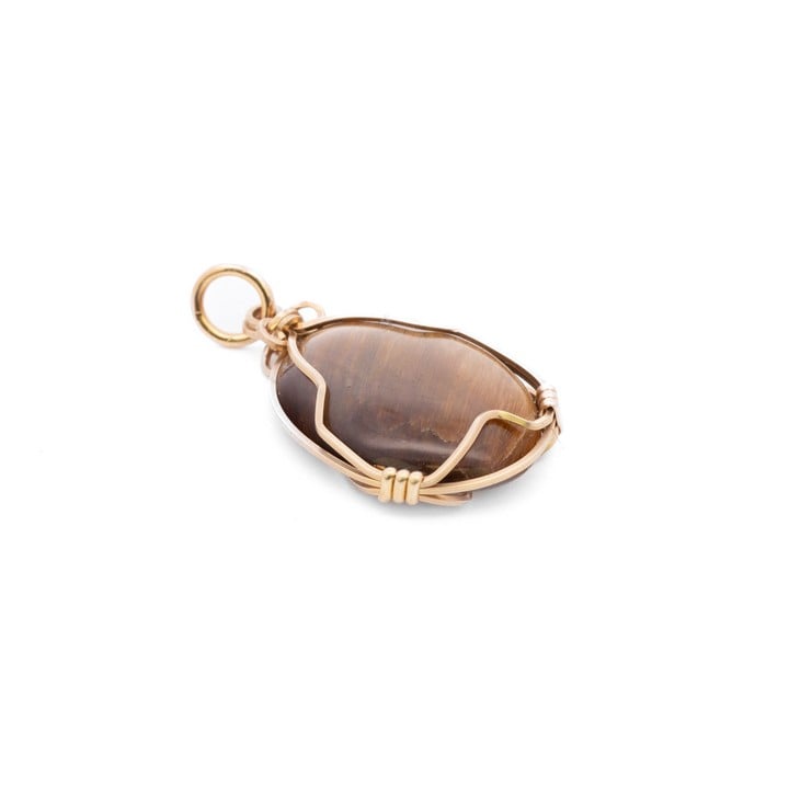 Gold Plated Metal Tigers Eye Pendant, 2.8x1.7cm, 2.5g.  Auction Guide: £300-£400 (VAT Only Payable on Buyers Premium)