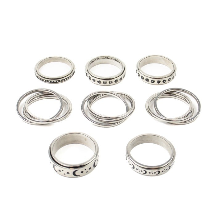 Selection of Eight Metal Patterned Spinner Band Rings, Size V½, total weight 43.4g (VAT Only Payable on Buyers Premium)