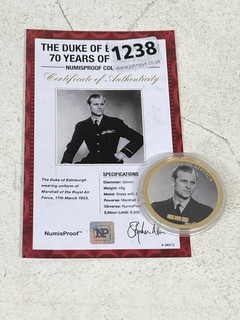 A 24 CARAT GOLD PLATED BRASS COMMEMORATIVE COIN, HRH THE DUKE OF EDINBURGH, 70 YEARS OF SERVICE, WITH EDITION CERTIFICATE: LOCATION - BR1